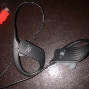 JBL Bluetooth earphones w/ charger cord.